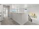 Bright upstairs hallway with carpet, leading to bedrooms and bath at 3391 N Buchanan Way, Aurora, CO 80019