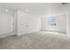 Spacious bonus room with carpet and large window at 3391 N Buchanan Way, Aurora, CO 80019