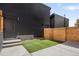 Private backyard with artificial turf and a wooden fence at 1262 N Stuart St # 2, Denver, CO 80204