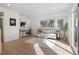 Bright, finished basement recreation room with a sofa, desk, and access to a backyard patio at 1262 N Stuart St # 2, Denver, CO 80204