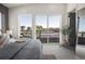 Bright bedroom with sliding glass doors leading to a balcony at 1262 N Stuart St # 2, Denver, CO 80204