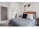 Bright bedroom with ensuite bathroom access and modern decor at 1262 N Stuart St # 2, Denver, CO 80204