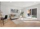 Bright, finished basement recreation room with a sofa, desk, and access to a backyard patio at 1262 N Stuart St # 2, Denver, CO 80204