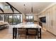 Modern kitchen with large island, quartz countertops, stainless steel appliances, and mountain views at 245 Fairways Dr, Breckenridge, CO 80424