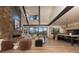 Open concept living and kitchen area with hardwood floors and mountain views from large windows at 245 Fairways Dr, Breckenridge, CO 80424