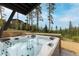 Relax in this luxurious hot tub with mountain views at 245 Fairways Dr, Breckenridge, CO 80424