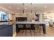 Modern kitchen with large island, quartz countertops, and stainless steel appliances at 245 Fairways Dr, Breckenridge, CO 80424