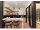 Modern wet bar with wine storage and seating for two at 245 Fairways Dr, Breckenridge, CO 80424