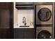 Modern laundry room with LG washer and dryer, sink, and cabinetry at 245 Fairways Dr, Breckenridge, CO 80424
