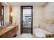 Bathroom with freestanding tub and bedroom view at 1133 14Th St # 2620, Denver, CO 80202