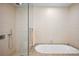 Bathroom with soaking tub and glass shower at 1133 14Th St # 2620, Denver, CO 80202