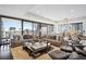 Luxurious living room with city views, modern furniture, and large windows at 1133 14Th St # 2620, Denver, CO 80202