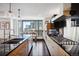 Modern kitchen with stainless steel appliances and breakfast bar at 1133 14Th St # 2620, Denver, CO 80202