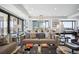Open concept living room and dining area with city views and modern decor at 1133 14Th St # 2620, Denver, CO 80202
