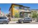 Modern home with yellow and gray exterior, two cars parked at 1998 Foxtail Ln # B, Lafayette, CO 80026