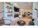 Open living room with modern fireplace and kitchen at 1998 Foxtail Ln # B, Lafayette, CO 80026