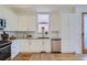 Modern kitchen with stainless steel appliances and white cabinetry at 1998 Foxtail Ln # B, Lafayette, CO 80026