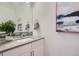 Modern bathroom with gray countertop and white cabinets at 1998 Foxtail Ln # B, Lafayette, CO 80026