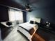 Spacious bedroom with a king-size bed and plenty of natural light at 10330 W Jewell Ave # A, Lakewood, CO 80232