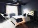 Spacious bedroom with a king-size bed and plenty of natural light at 10330 W Jewell Ave # A, Lakewood, CO 80232