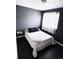 Small bedroom with a double bed and dark blue walls at 10330 W Jewell Ave # A, Lakewood, CO 80232