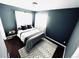 Cozy bedroom with a queen-size bed and natural light at 10330 W Jewell Ave # A, Lakewood, CO 80232
