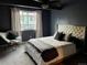 Spacious bedroom with a king-size bed and plenty of natural light at 10330 W Jewell Ave # A, Lakewood, CO 80232