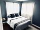 Cozy bedroom with a queen-size bed and natural light at 10330 W Jewell Ave # A, Lakewood, CO 80232
