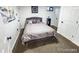 Well-lit bedroom with a comfortable bed and plush carpeting at 7054 Welch Ct, Arvada, CO 80004