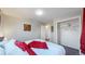 Comfortable bedroom with king-size bed, closet, and adjacent bathroom at 7248 S Broadway, Centennial, CO 80122