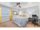 Cozy bedroom with a ceiling fan and a built-in workspace at 7081 Palisade Dr, Highlands Ranch, CO 80130