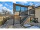 Backyard deck with stairs and attached sunroom at 12140 E 116Th Cir, Henderson, CO 80640