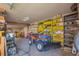 Garage with ATV, shelves, and ample storage space at 12140 E 116Th Cir, Henderson, CO 80640