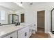 Modern bathroom with white cabinets, quartz countertop, and walk-in shower at 42996 Colonial Trl, Elizabeth, CO 80107