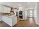 Modern kitchen with island and open floor plan at 42996 Colonial Trl, Elizabeth, CO 80107
