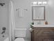 Clean bathroom with updated vanity, shower/tub combo, and neutral decor at 1260 York St # 105, Denver, CO 80206