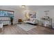 Bright living room features hardwood floors, comfy seating, and large artwork at 1260 York St # 105, Denver, CO 80206