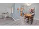Bright dining area with wood table and leather chairs at 1260 York St # 105, Denver, CO 80206