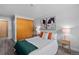 Spacious bedroom with wood closet doors, and light and airy decor at 1260 York St # 105, Denver, CO 80206