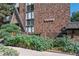 Brick building exterior with landscaping and the name Viking Twelve Sixty at 1260 York St # 105, Denver, CO 80206