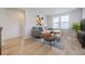 Cozy living room featuring a comfortable sectional sofa and wood-look floors at 11076 Star Fall St, Littleton, CO 80125