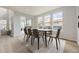 Dining area with access to the patio and modern table and chairs at 11076 Star Fall St, Littleton, CO 80125