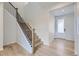 Modern staircase with wood treads and black metal railing at 11076 Star Fall St, Littleton, CO 80125