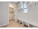Functional mudroom with built-in bench, cubbies, and coat hooks at 11076 Star Fall St, Littleton, CO 80125