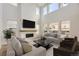 Spacious living room with fireplace and large windows at 11076 Star Fall St, Littleton, CO 80125
