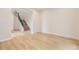 Light and airy hallway with stairs and wood flooring at 11076 Star Fall St, Littleton, CO 80125