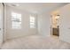 Light-filled bedroom with neutral walls and carpet flooring at 11076 Star Fall St, Littleton, CO 80125
