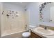 Clean bathroom with butterfly-themed decor at 9132 Fayette St, Denver, CO 80260