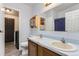 Bathroom boasts double sinks and updated vanity at 9132 Fayette St, Denver, CO 80260