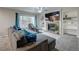 Living room with a fireplace, built in shelving and large TV at 5724 S Bahama W Cir, Aurora, CO 80015